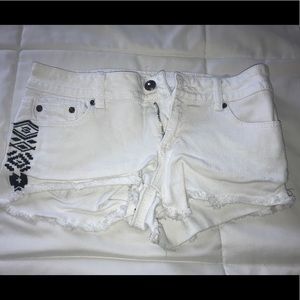 White denim shorts tribal side